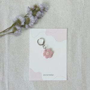 Marcador para agujas o ganchillo, con forma de flor en color rosa de diferentes tonos